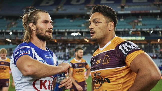 Kieran Foran and Alex Glenn speak after the match. Picture: Brett Hemmings/Getty Images