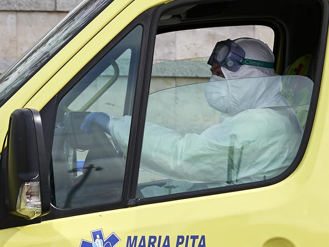 A paramedic driving an ambulance arrives at the entrance of IFEMA, the exhibitions venue that will host a campaign hospital to assist coronavirus patients from Madrid hospitals in Madrid, Spain. Picture: Getty Images