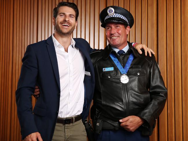 Constable Arun Trevitt with Dan Price at the Pride of Australia awards. Picture: Tim Hunter