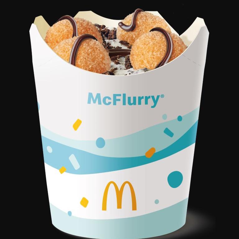 It features creamy soft serve topped with chocolate hot fudge sauce and crushed Oreo cookie with four doughnut balls.