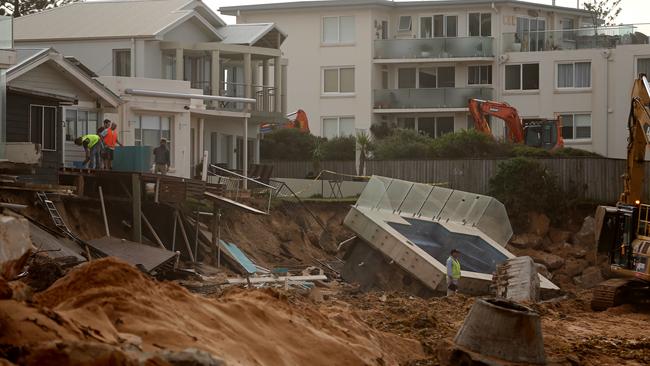 Homes along Pittwater Rd at Collaroy were battered by a king tide and severe storm in Sydney in 2016. Picture: John Grainger