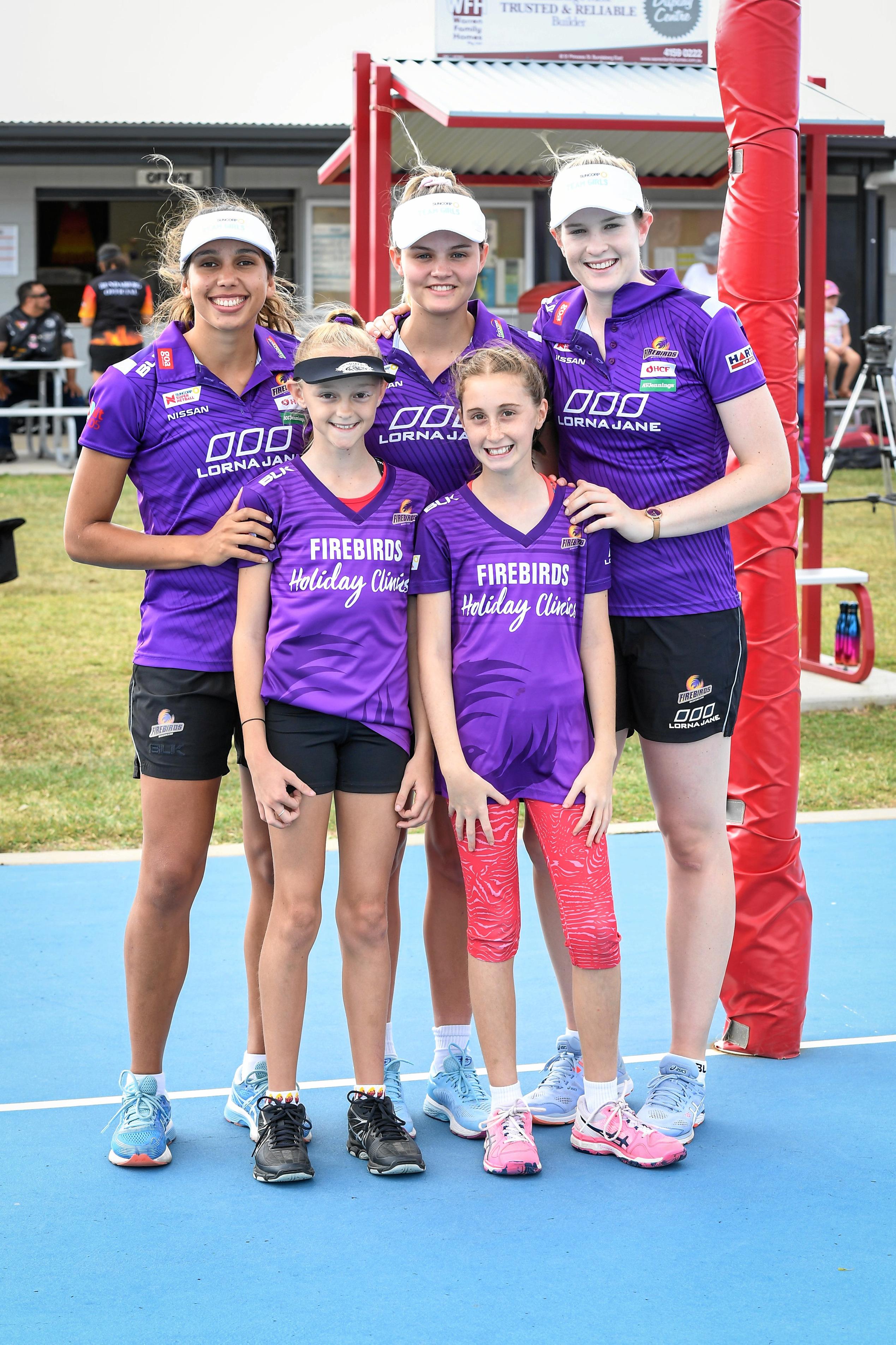 Jemma Mi Mi, Tippah Dwan and Tarah Hinchliffe with two of their biggest fans, Caitlyn Weston and Elisabeth Pitt. Picture: Brian Cassidy