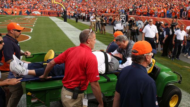 Defensive co-ordinator Wade Phillips of the Denver Broncos is carted off.