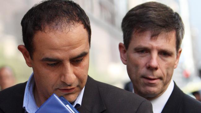 Purana task force officers arrest Rob Karam, left. Picture: Supplied