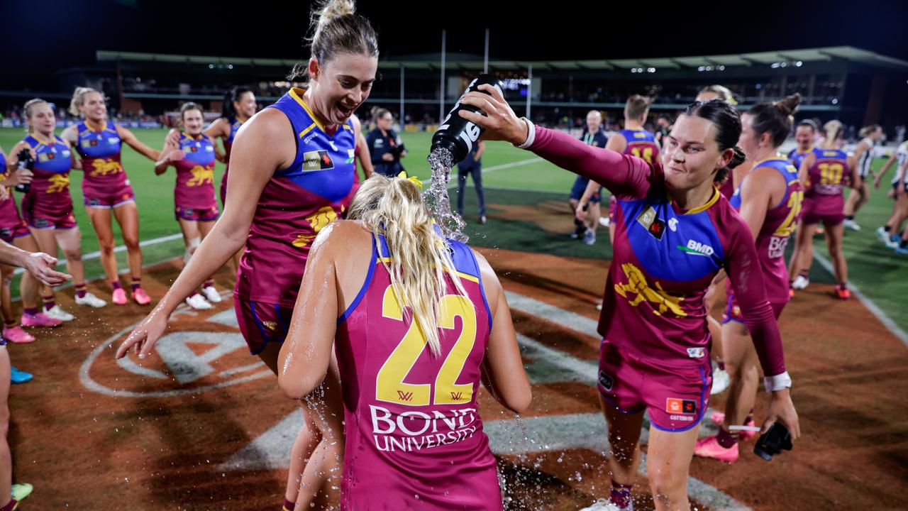 Sophie Peters and Sophie Conway of the Lions celebrate the win. Picture: Russell Freeman/AFL Photos via Getty Images.