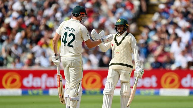 Usman Khawaja is congratulated by teammate Cameron Green on his half-century. Picture: Getty