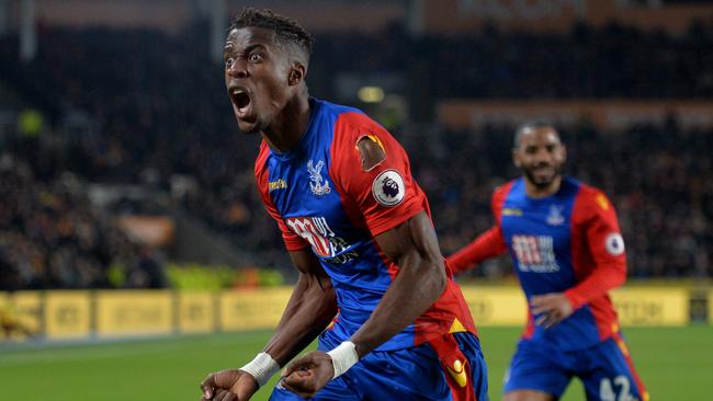 Crystal Palace's Wilfried Zaha celebrates after scoring.