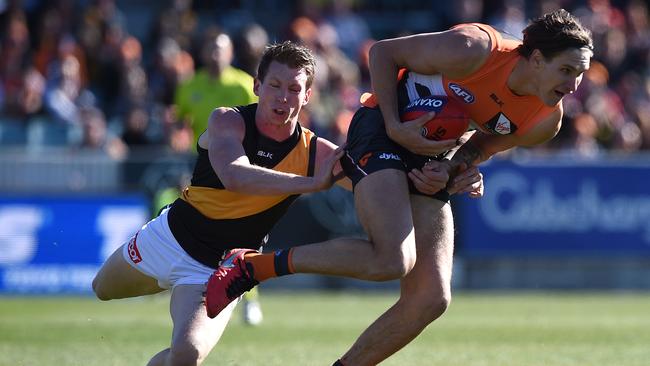 Rory Lobb marks in front of Dylan Grimes. Picture: AAP