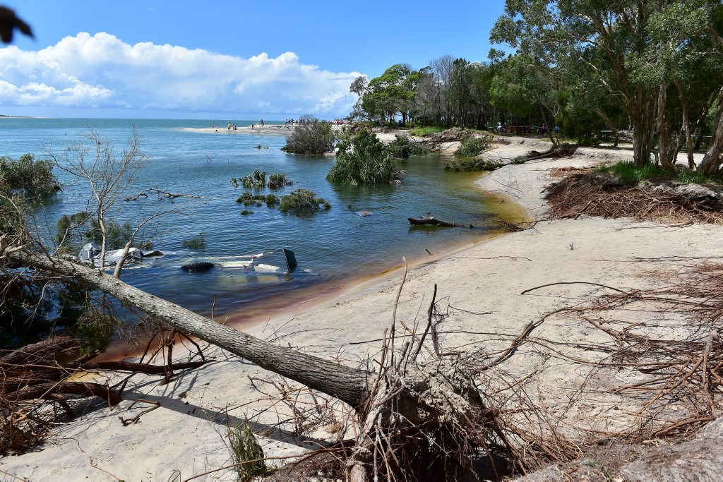 A large sink hole has swallowed a large chunk of the camping area on Inskip Point, taking with it a caravan, camper trailer and one vehicle. Photo: Che Chapman / Sunshine Coast Daily. Picture: Che Chapman