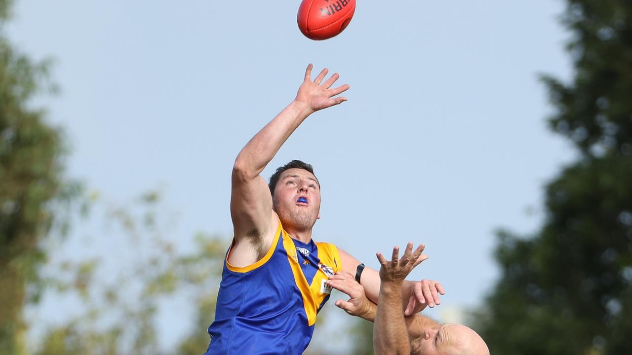 Scott Greenhough goes up in the ruck for Deer Park. Picture: Local Legends Photography