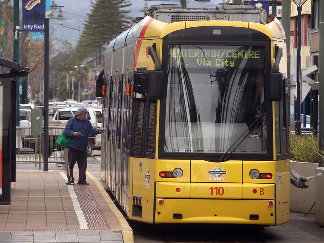 SA man Danny Piscopo and his son Harrison, 3 years old, from Upper Sturt, about to catch the tram from Glenelg to Adelaide.
