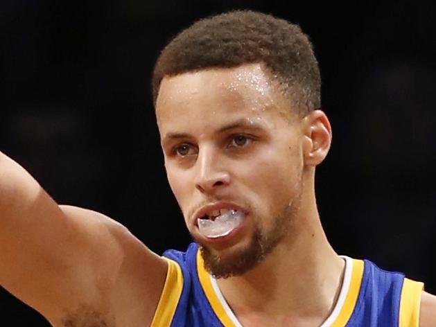 Golden State Warriors guard Stephen Curry (30) reacts after scoring in the second half of an NBA basketball game against the Brooklyn Nets, Sunday, Dec. 6, 2015, in New York. Curry had 28 points as the Warriors defeated the Nets 114-98. (AP Photo/Kathy Willens)