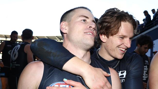 Matthew Owies and Brodie Kemp celebrate the win against the Suns. Picture: Robert Cianflone/Getty Images