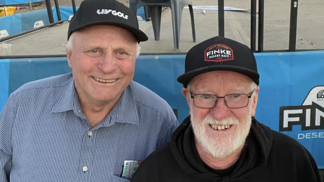 Malcolm Axford, left, with Deane ‘Feathers’ Boston visiting the Tatts Finke Desert Race in 2023. Both travelled together from SA to compete in the enduro event 47 years earlier. Photo: Finke Desert Race/Facebook