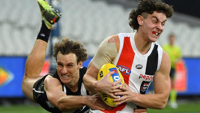 Nick Coffield and Chris Mayne doing battle in a previous Magpies-Saints clash. Picture: Quinn Rooney/Getty Images