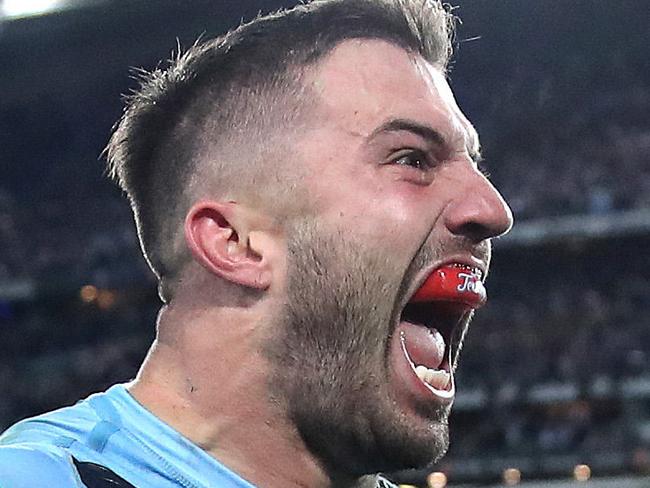 NSW's James Tedesco celebrates winning try with Mitchell Pearce during Game 3 of the State of Origin series between NSW Blues and Queensland at ANZ Stadium, July 10, 2019. Picture. Phil Hillyard