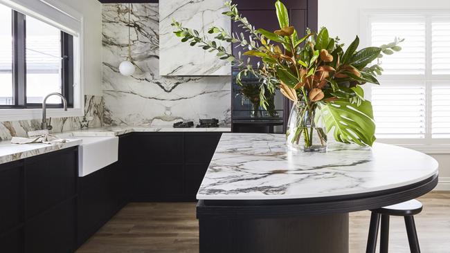 This Neolith kitchen features Calacatta Luxe and Himalaya Crystal, neolith.com Design: Trentini Design Picture: Amanda Prior