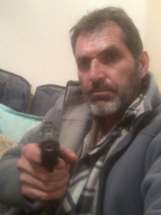 Heinze posed with many of his possessions including this pistol, in his social media postings. Image: Facebook.