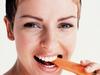 Woman eating carrot for healthy skin. / Situation / Women vegetables carrots model health generic