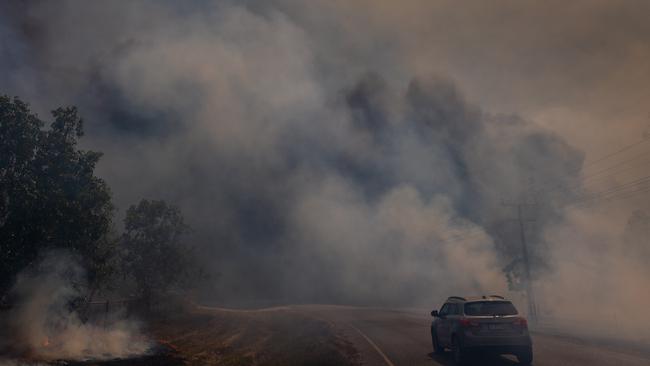 Properties in the Darwin rural area were once again under threat from bushfire on Monday, which was another severe fire danger day for the region. Picture: Che Chorley