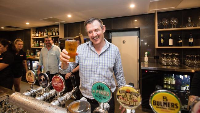 Chief Minister Michael Gunner pours a schooner at the Cavenagh Hotel in the lead-up to NT pubs reopening. Picture: Glenn Campbell