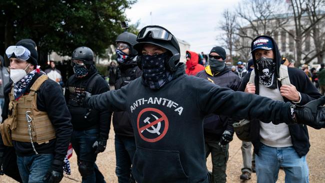 Protester who claim to be a members of the Proud Boys gather with other Trump supporters outside the US Capitol. Picture: Alex Edelman/AFP