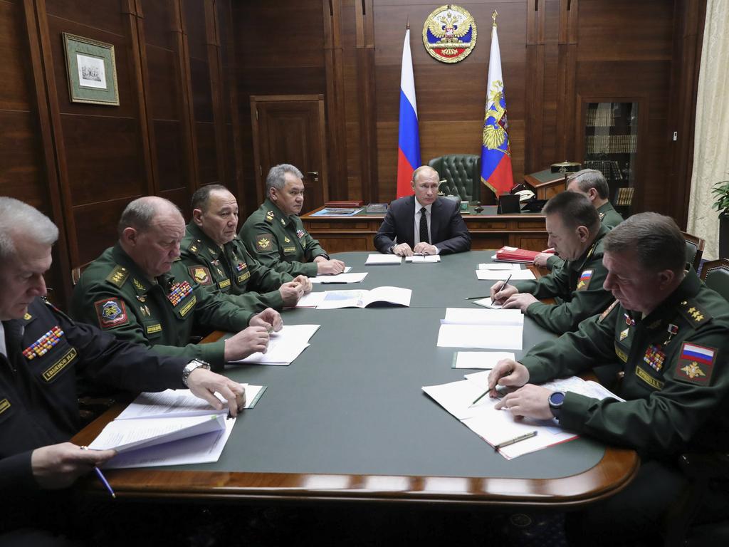 Russian President Vladimir Putin speaks to the top military staff in the Russian Defense Ministry's headquarters in Moscow, Russia. Picture: AP