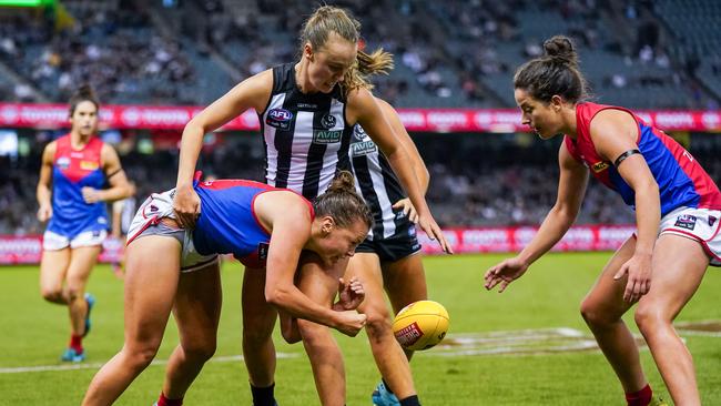 Maddison Gay and Jordyn Allen in the thick of it during last year’s clash between the Pies and Dees. Picture: AAP