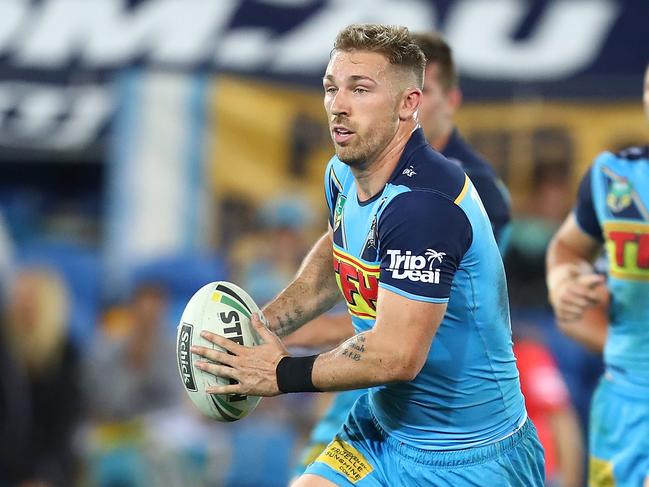 Bryce Cartwright of the Titans runs the ball during the round eight NRL match between the Gold Coast Titans and Cronulla Sharks at Cbus Super Stadium on April 28, 2018 in Gold Coast, Australia. Picture: Chris Hyde/Getty Images.