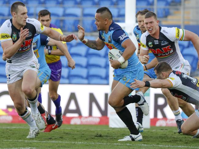 Phillip Sami of the Titans runs with the ball during the Round 22 NRL match between the Gold Coast Titans and the Penrith Panthers at Cbus Super Stadium on the Gold Coast, Saturday, August 11, 2018. Picture: AAP Image/Glenn Hunt