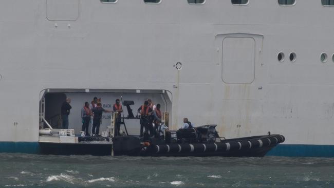 Police board the Pacific Explorer. Picture: Adolfo Nazario.