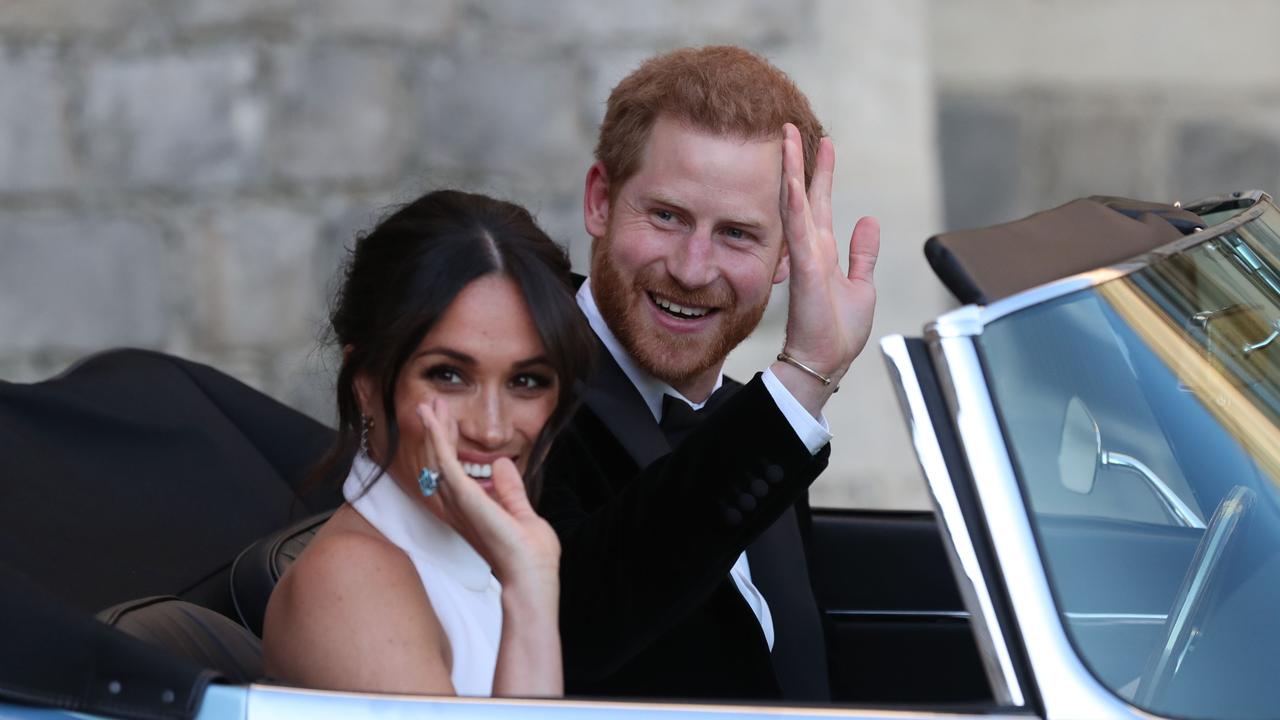 The newlyweds drove an E-Type Jaguar after their wedding to attend an evening reception at Frogmore House. Picture: Steve Parsons