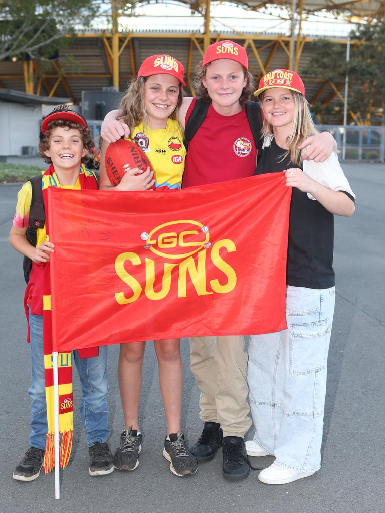 The Gold Coast Suns will host its first AFLW final when they take on the Sydney Swans on Saturday night. Joli, Willow, Talin Hall with Danni McDonald. 11 November 2023 Carrara Picture by Richard Gosling