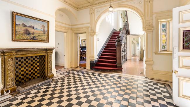 The imposing entrance replete with black and white marble flooring