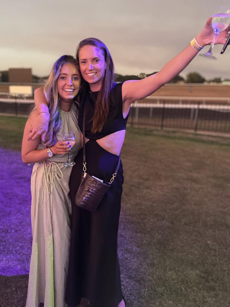 Greta Wenck and Mikaela Wells at the Darwin Cup Gala Ball. Picture: Bethany Griffiths