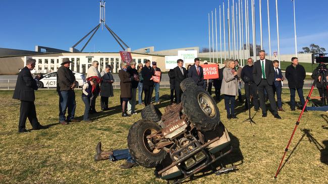 Ugly truth: A quadbike rollover demonstrated at Parliament House yesterday in the campaign for mandatory safety devices.