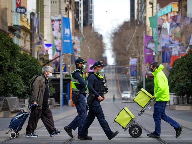 The streets of Melbourne are quiet under a Stage Four Covid-19 lockdown. PSO's on Bourke St. Picture: Mark Stewart