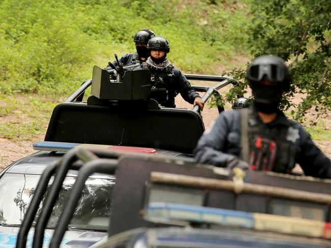 The Sinaloa State Police Elite Prevention Squad guard the site of a large Methamphetamine lab in the hills outside Culiacan. Picture: Nathan Edwards