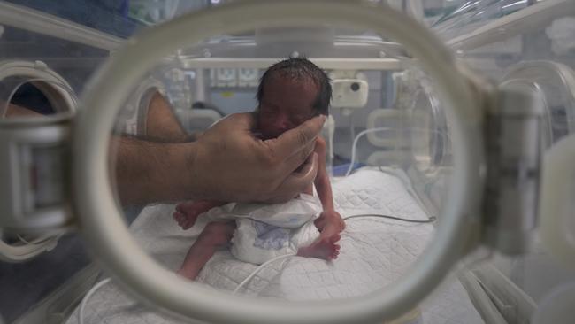 While the NSW Upper House shut down any debate on aborting little girls in favour of male heirs, they did find the time to chew the fat on babies in Gaza, a region they have precisely zero influence. Picture: AP Photo/Abdel Kareem Hana