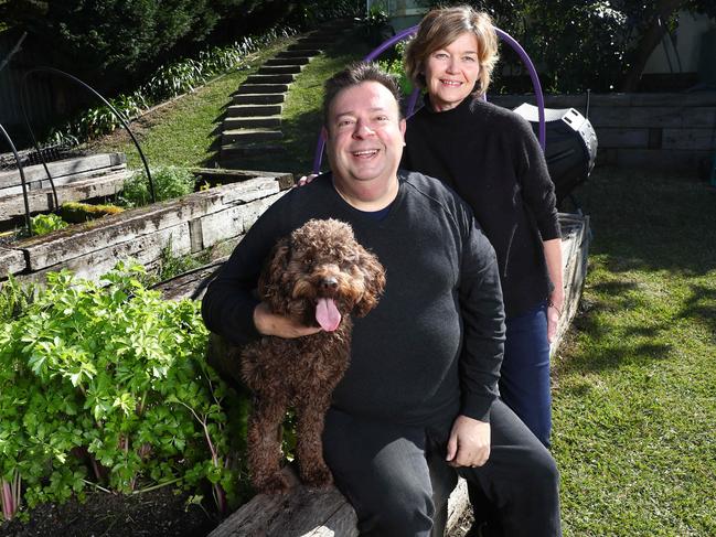 Gilmore with wife Kath and dog Miles at the couple’s home. Picture: John Feder