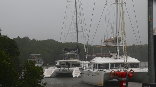 The Sailaway Reef & Island Tours fleet weathers the storm in Dickson Inlet, Port Douglas. Picture: Peter Carruthers