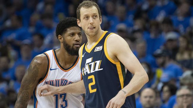 Joe Ingles #2 of the Utah Jazz defends against Paul George #13 of the Oklahoma City Thunder.