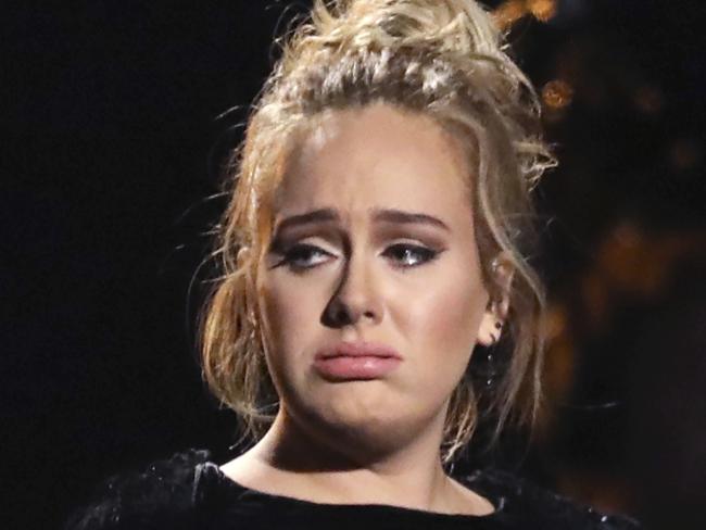 Adele reacts after concluding a performance tribute to George Michael at the 59th annual Grammy Awards on Sunday, Feb. 12, 2017, in Los Angeles. (Photo by Matt Sayles/Invision/AP)