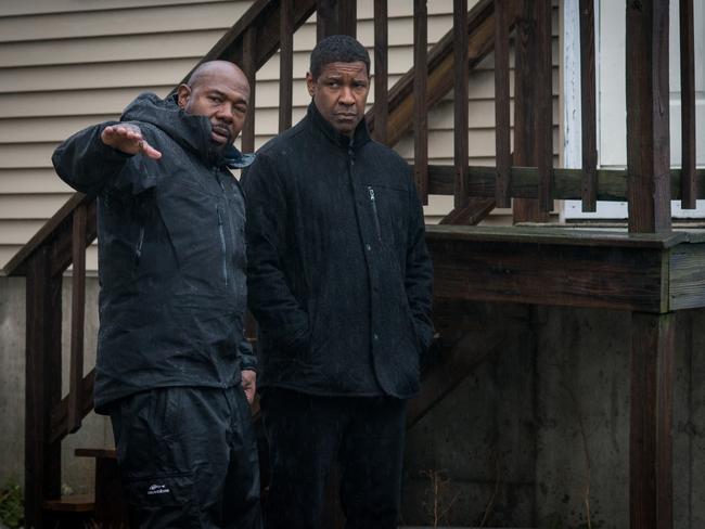 Director Antoine Fuqua sets the scene with Washington on the set of ‘The Equalizer 2’. The film marks the pair’s fourth collaboration. Picture: Sony Pictures