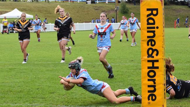 Maddison D'Ombrain crosses for the Milton-Ulladulla Bulldogs Open women's tackle team. Picture: Supplied