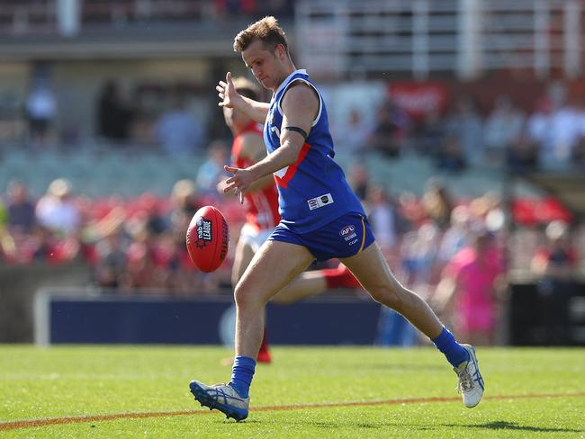 Lachlan Stapleton gets a kick away. Picture: Graham Denholm/AFL Photos/Getty Images