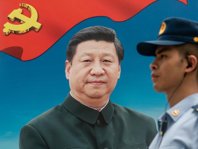 HONG KONG, HONG KONG - June 30: A member of the People's Liberation Army (PLA) stands guard in front of a billboard of Chinese President Xi Jinping at the Shek Kong Barracks on June 30, 2018 in Hong Kong, Hong Kong. Hong Kong will mark 21 years since its return to Chinese sovereignty from British rule on Sunday as thousands of people are expected to turn up for an annual rally to demand full democracy and vent their frustration over the soaring accommodation costs in the world's most expensive city for expatriates. (Photo by Anthony Kwan/Getty Images)