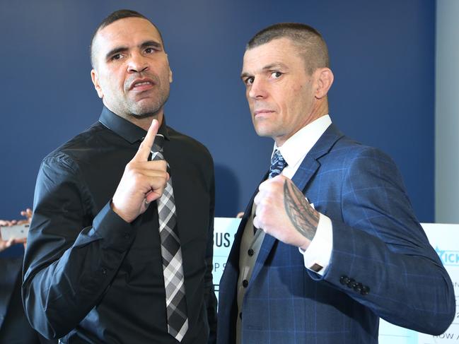 Anthony Mundine (left) and John Wayne Parr face off at Cbus Super Stadium ahead of their upcoming boxing match. Picture: Glenn Hampson