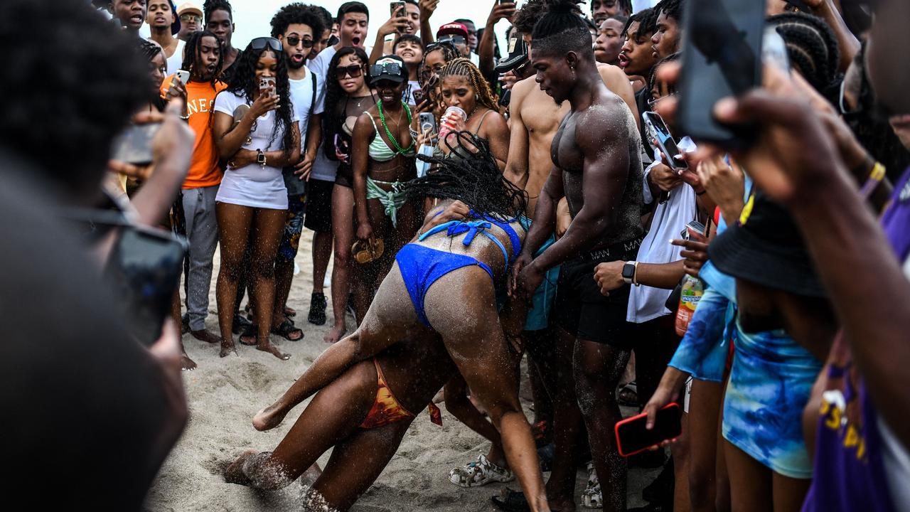 Revellers play beach football on the sand in Miami Beach on March 17. Picture: Chandan Khanna/AFP