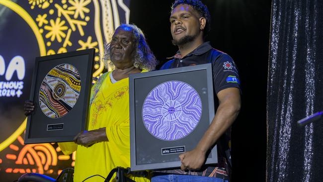 Warumpi Band founder Sammy Butcher's family accept his award at the 20th anniversary edition of the National Indigenous Music Awards at Darwin Amphitheatre on August 10, 2024. Picture: Paz Tassone